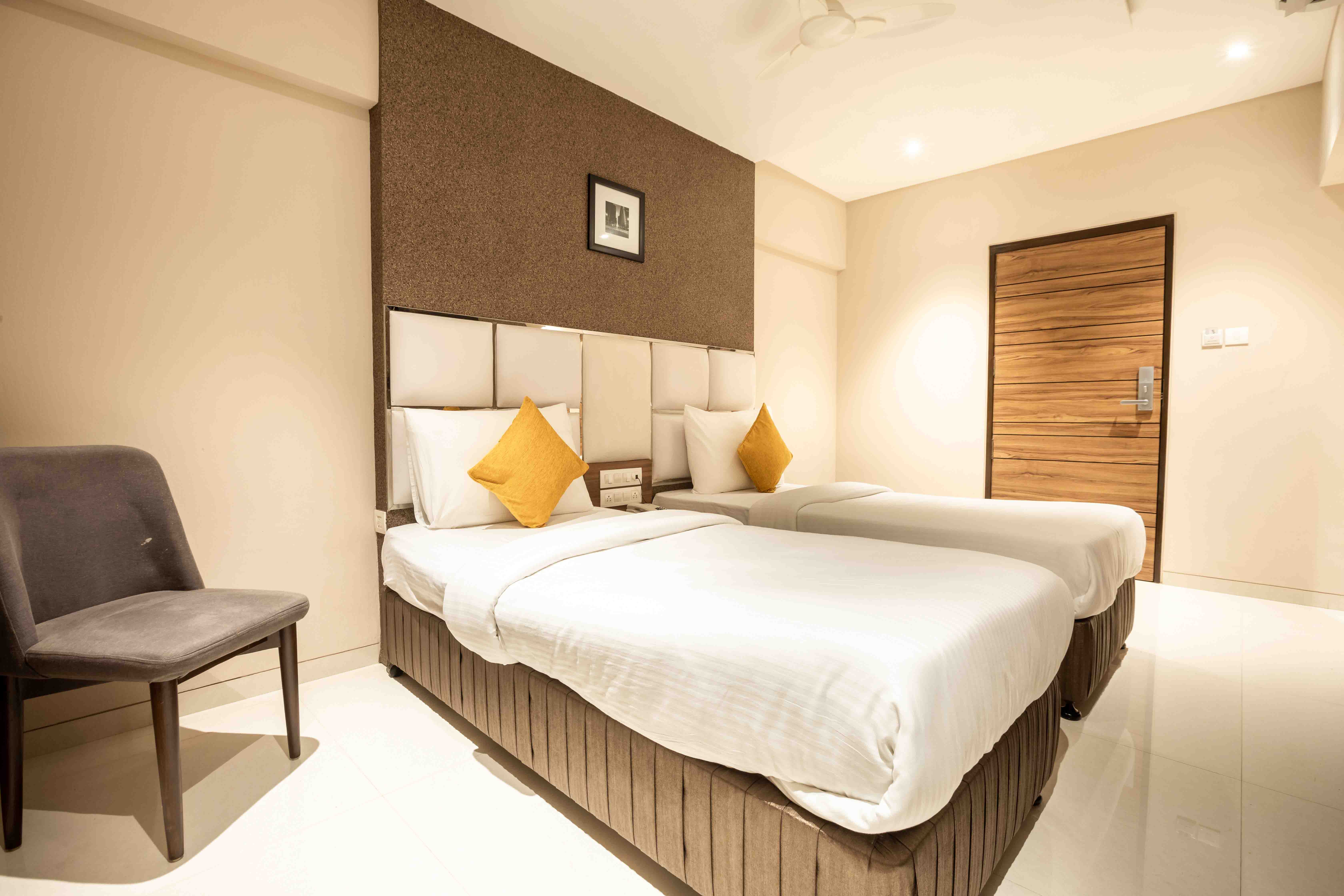 Smartly designed room for travelers at Hotel Pacific Residency.